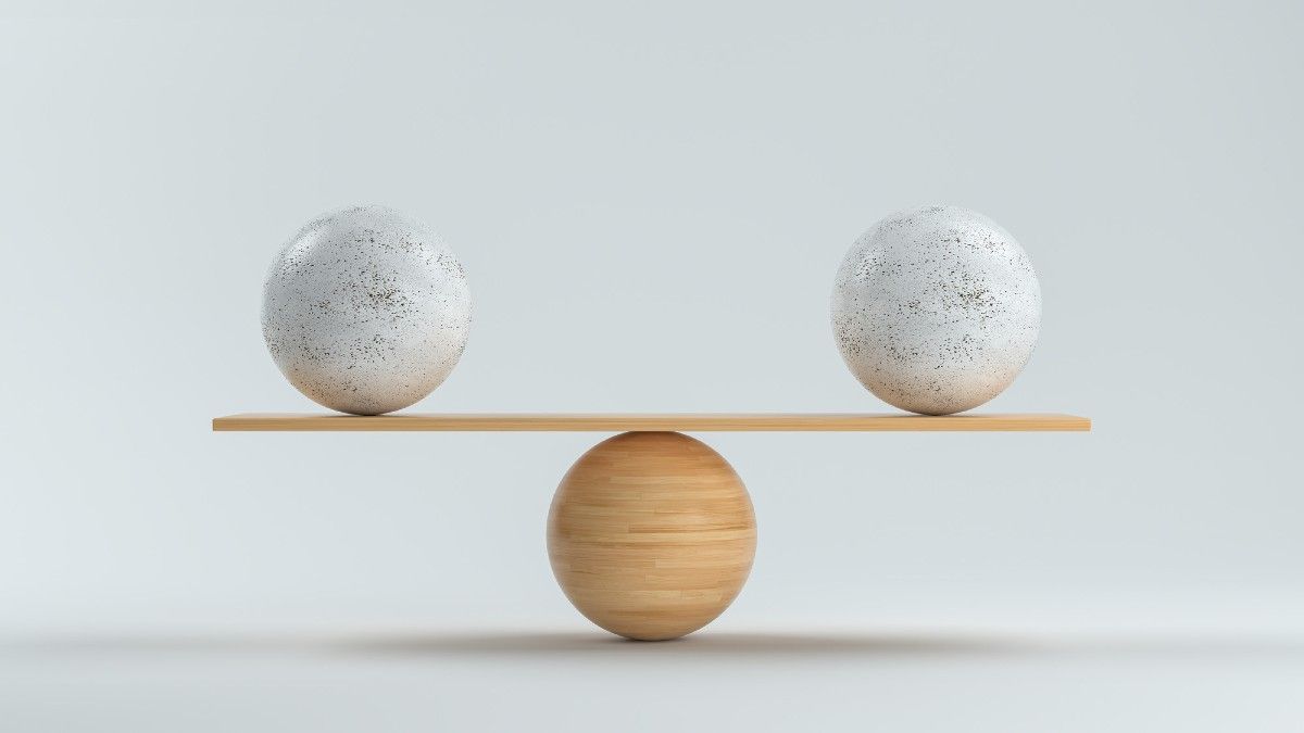 balls being balanced on a board