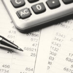 Calculator on top of financial statements.