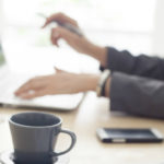 woman typing on keyboard to avoid payroll mistakes and have a stress free payroll process