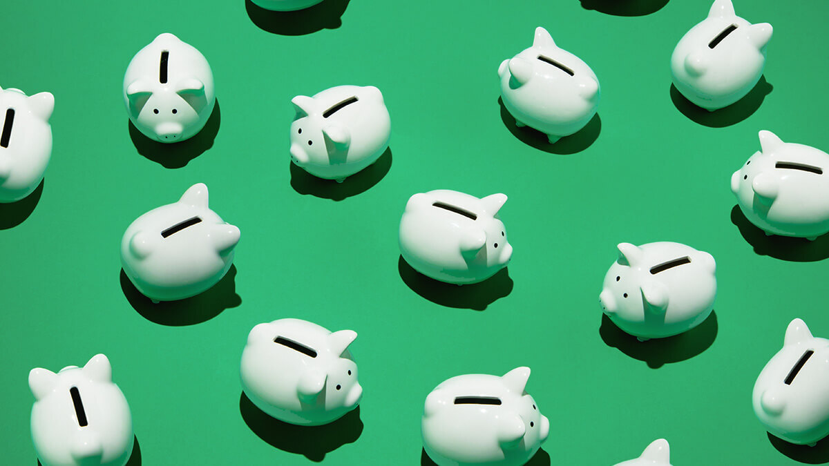 Piggy banks on a green background.