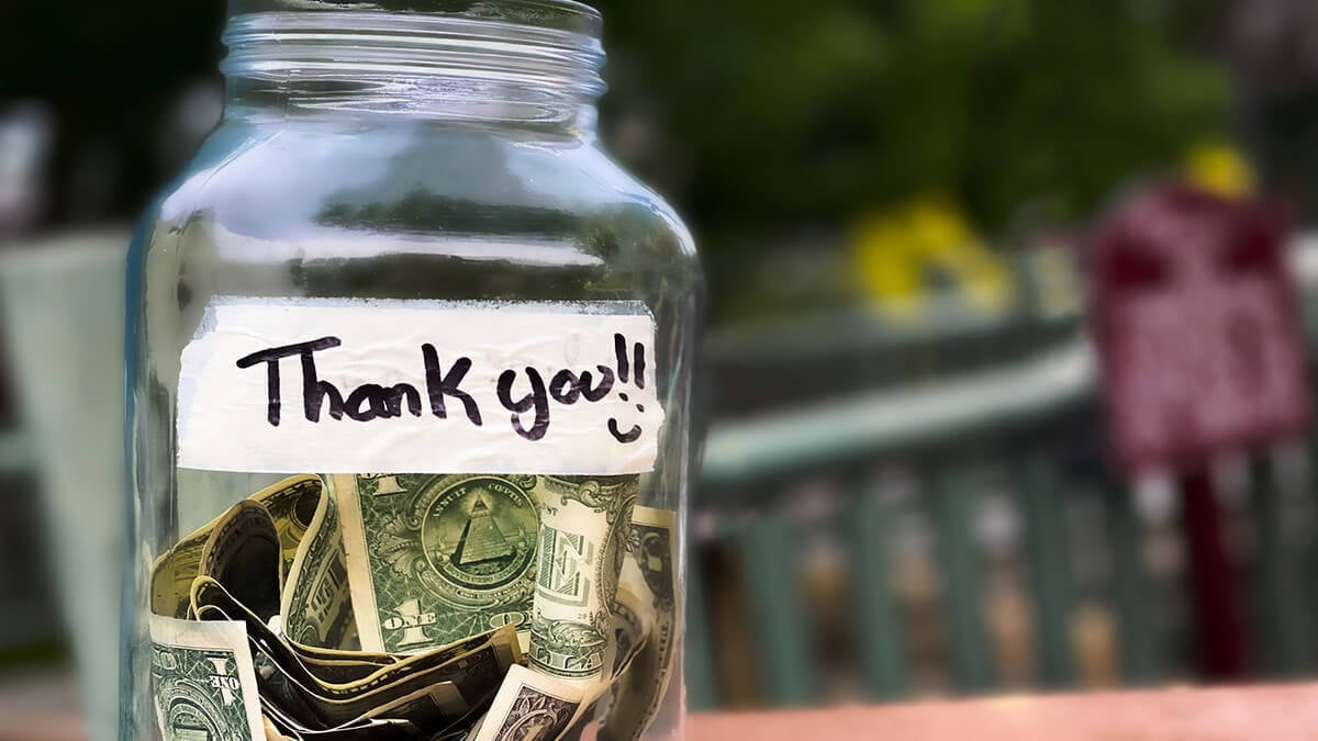 Tip jar with a sign that says "Thank you!"