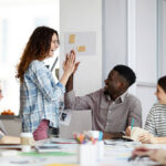 Small business interns in a meeting room.