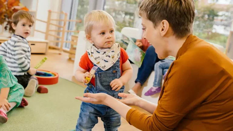 Daycare worker and toddlers.