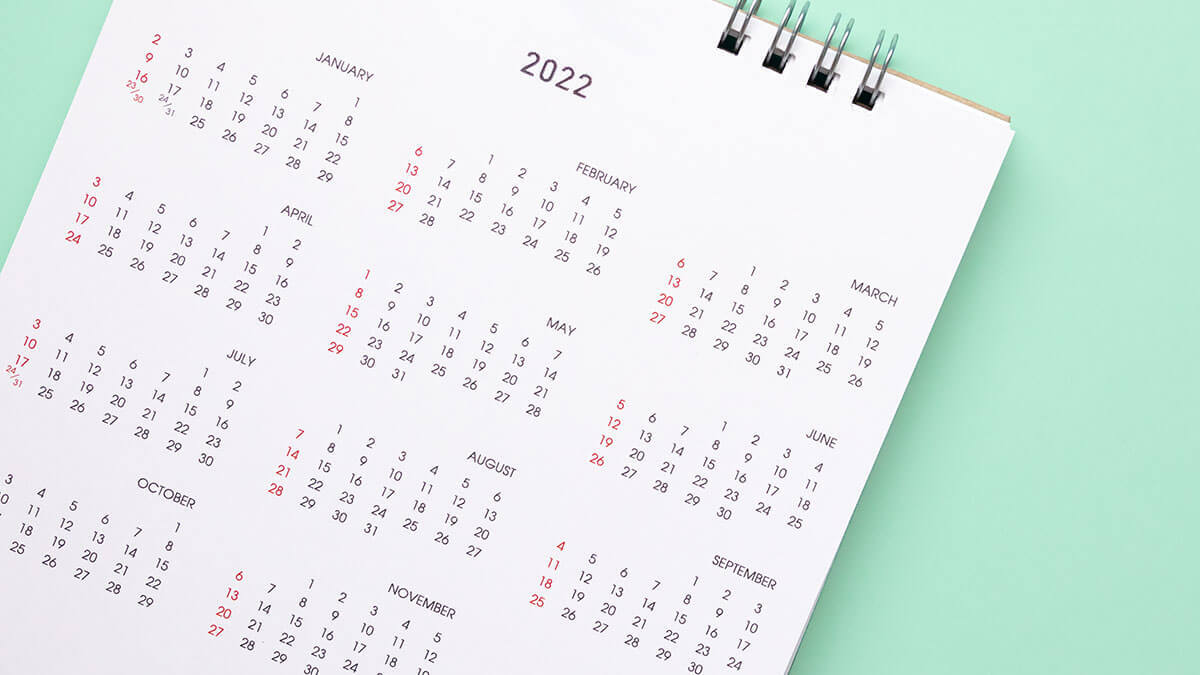 Annual calendar on a green background.