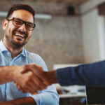 Two businessmen shaking hands.