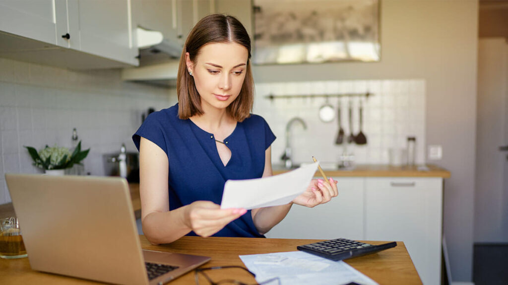 Woman starting the bank statement reconciliation process.