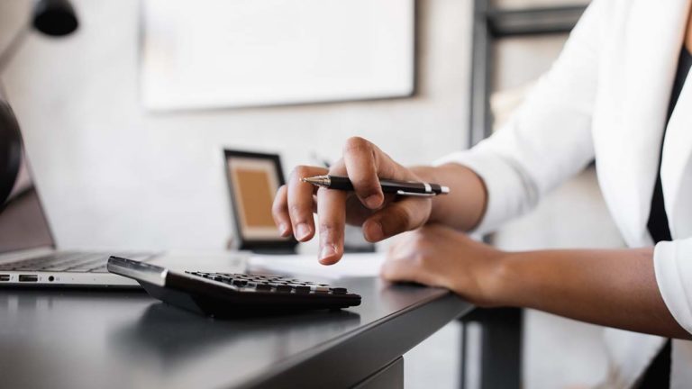 Employer using a calculator.