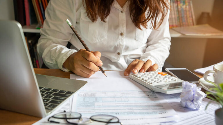 Woman filling out financial statements.