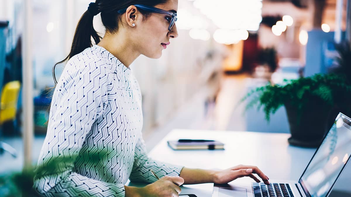 Employer reviewing tax exemption on a laptop.