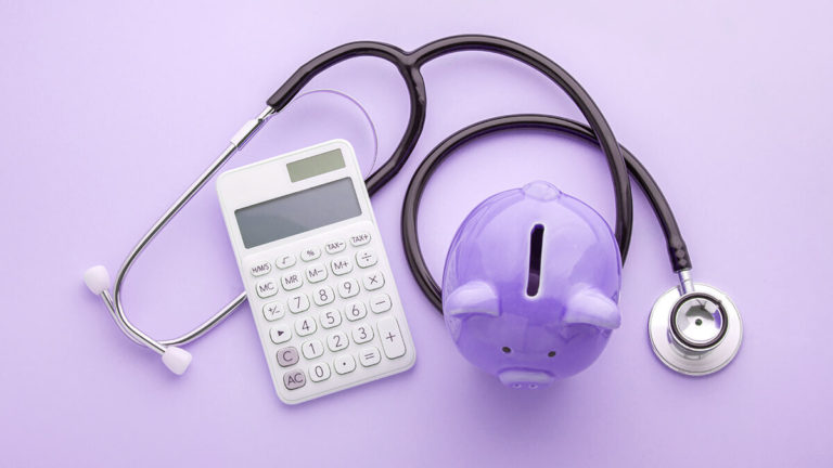 Purple pig, stethoscope, and calculator on purple background.