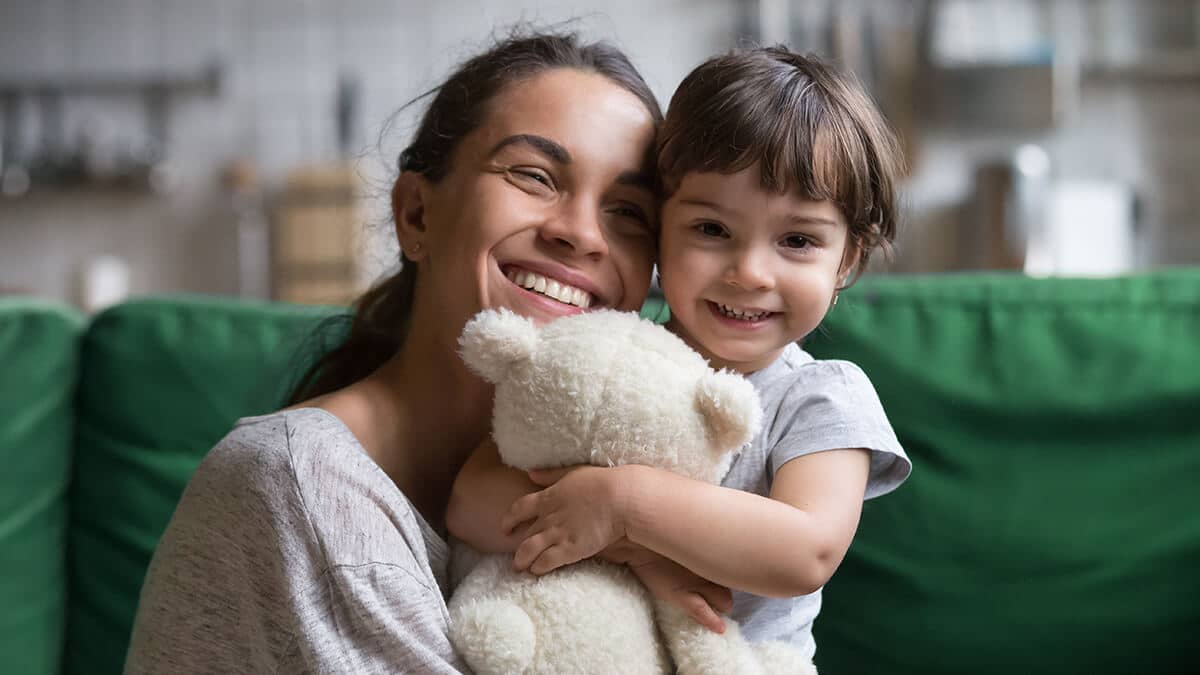Mom holding her daughter.