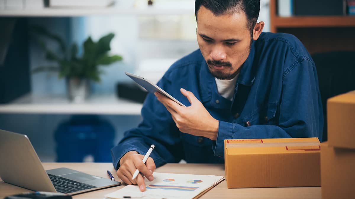 Man working on accrual accounting.