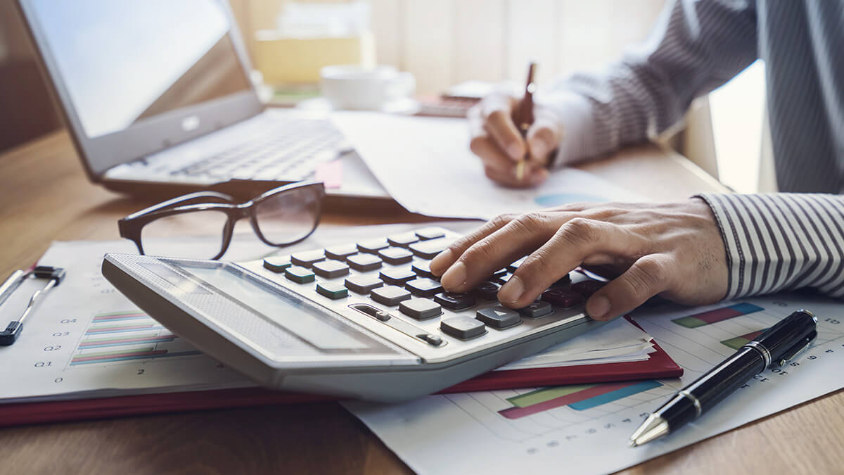 Business owner using a calculator.