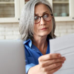 Focused woman reading a document.