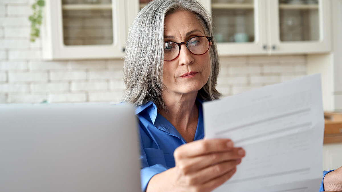 Focused woman reading a document.