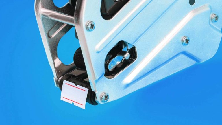 Pricing gun on a blue background.