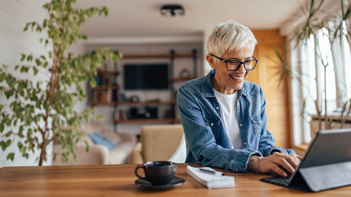 Older woman paying business taxes to the IRS.