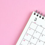 Calendar on a light pink background.