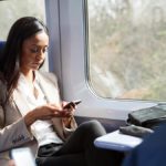 Two co-workers traveling on a train.