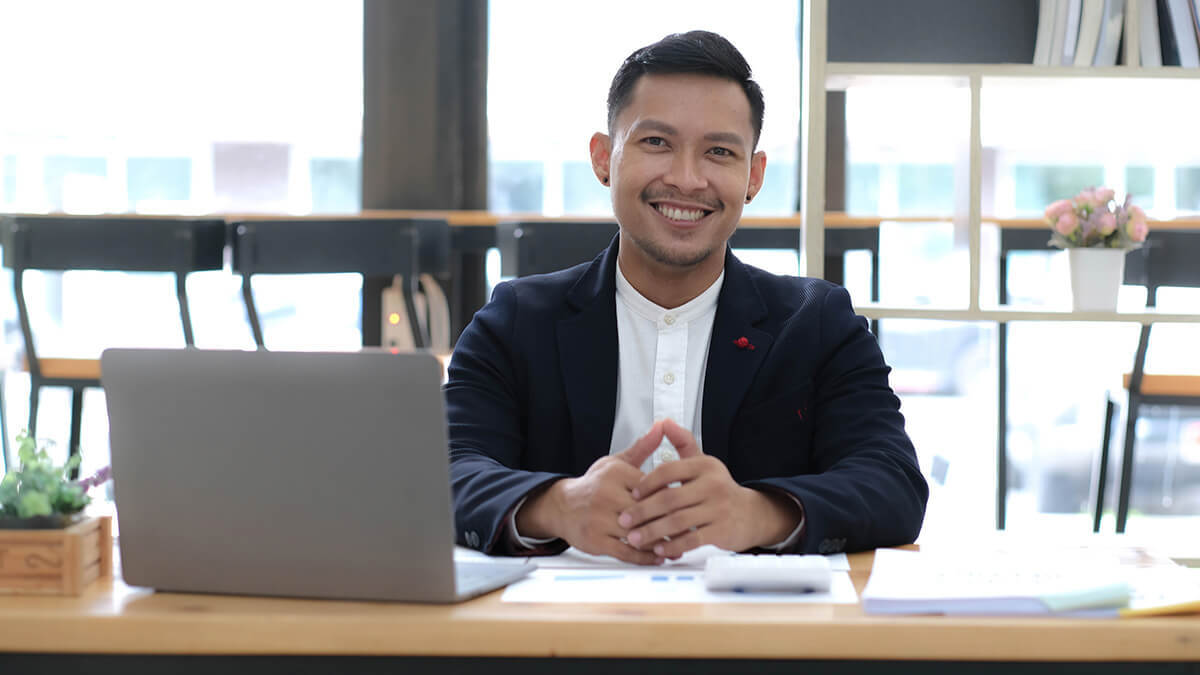 Man smiling at the camera.