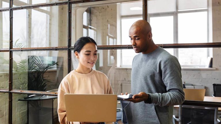 Two employees participating in a job rotation program.