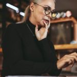 Middle aged woman using a laptop.