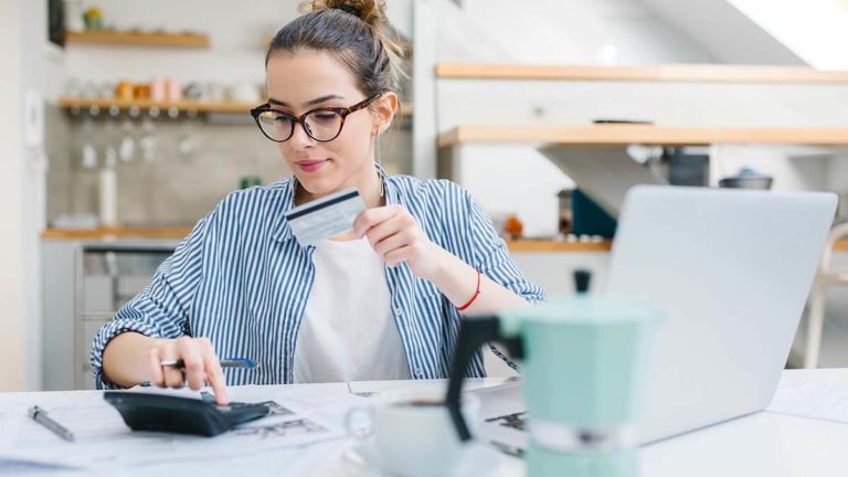 Business owner calculating deferred revenue.