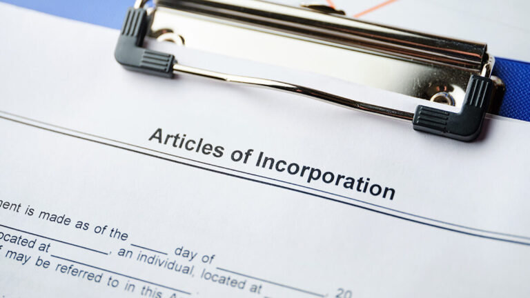 Clipboard that says Articles of Incorporation.