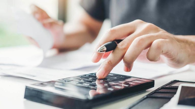 Employer calculating local income tax on calculator.