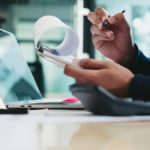 Business owner reviewing cost of goods sold.
