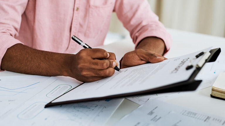 New hire filling out employee confidentiality agreement.