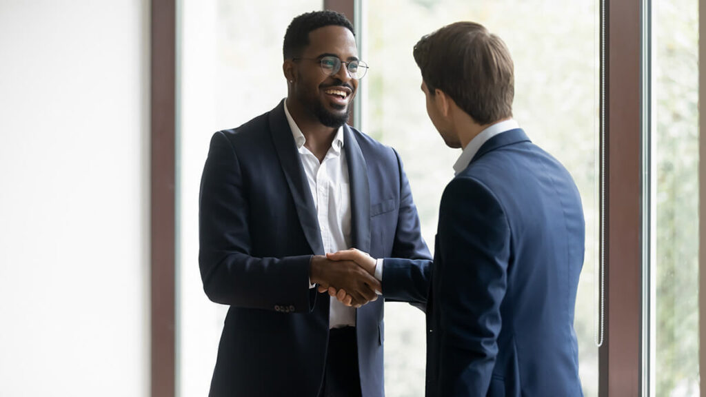 Two business partners shaking hands.