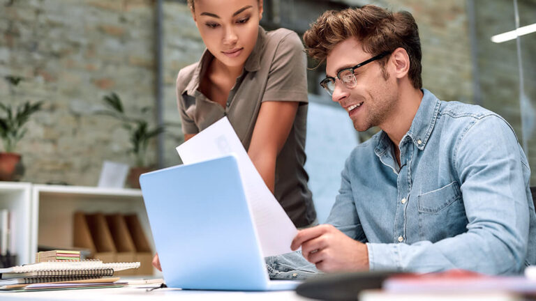 Man and woman working on articles of organization.