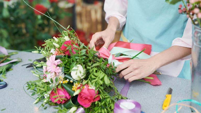 Florist putting together a beautiful bouquet.