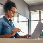 Woman filling out Form W-2 online.