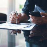 Business owner filling out documents.