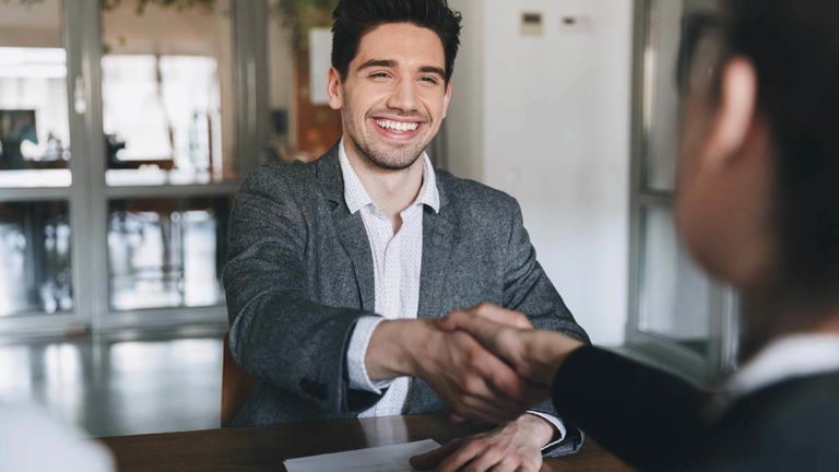 Two professionals shaking hands.