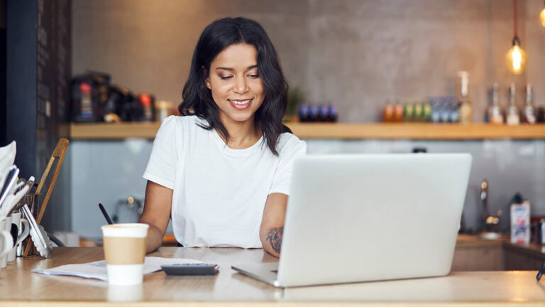 Business owner using a laptop.