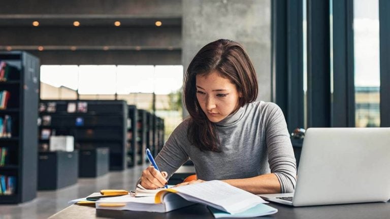 Woman filling out paperwork.