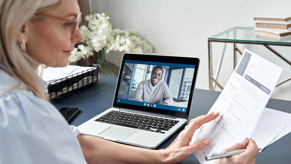 Woman on a virtual meeting with a man.
