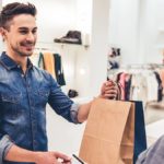 Customer paying for retail goods at the point of sale.