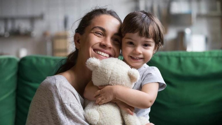 Mom and daughter smiling.