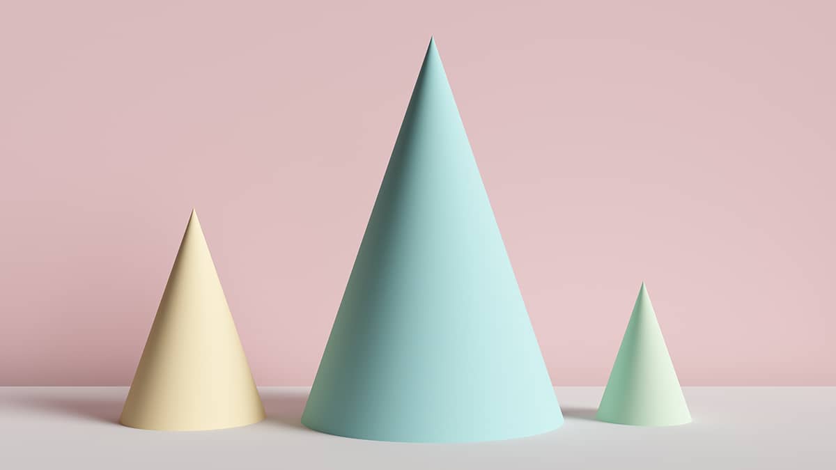 three pastel colored cones on a pink background