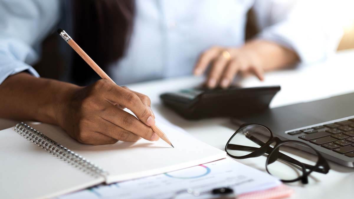 Woman filling out Schedule H.