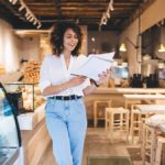 Bakery owner reviewing year-end payroll checklist.