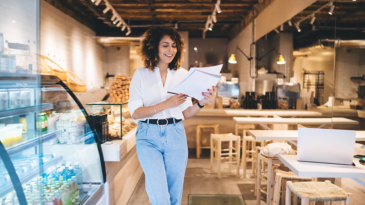 Bakery owner reviewing year-end payroll checklist.