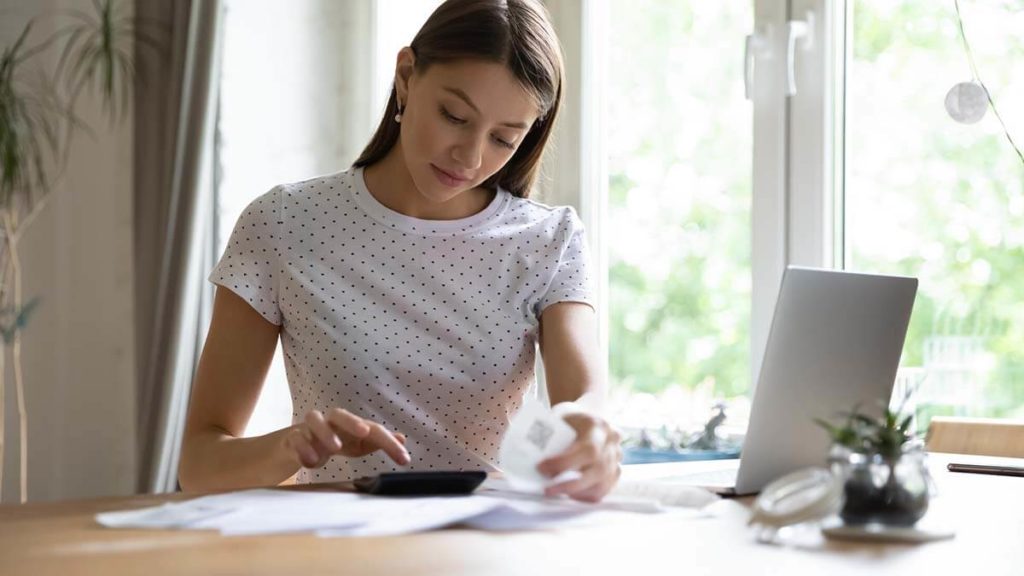 Woman using a calculator.