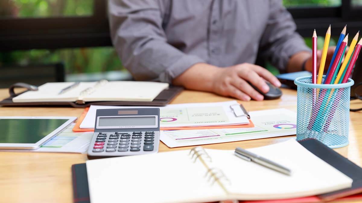 Man working on a balance sheet.