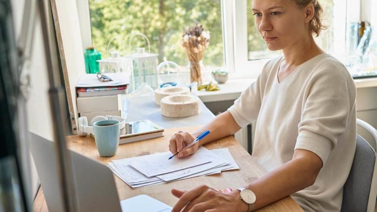Woman looking at her financial statements.