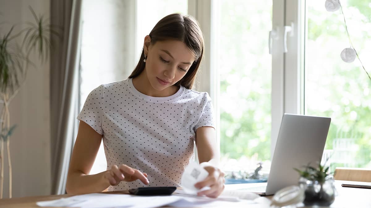 Woman calculating payroll taxes.